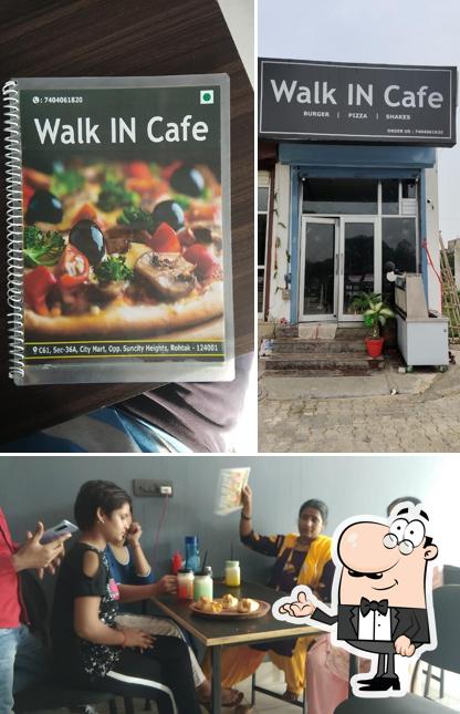 Take a seat at one of the tables at Walk IN Cafe