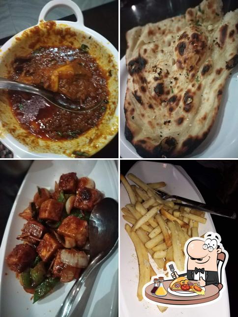 Pick pizza at Masala Twist Cafe and Restaurant (veg and non veg))