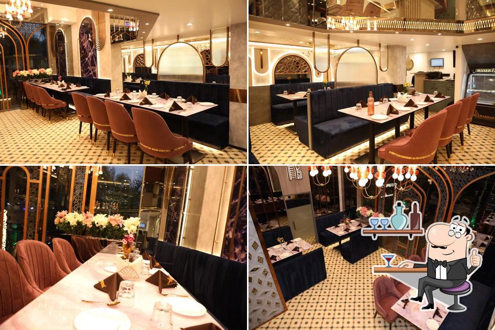 Take a seat at one of the tables at DUBAI DARBAR