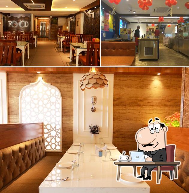 Take a seat at one of the tables at Rajshree Restaurant