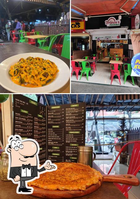 The photo of Franco's Pizzeria Delicious Pizza in Malad’s interior and food