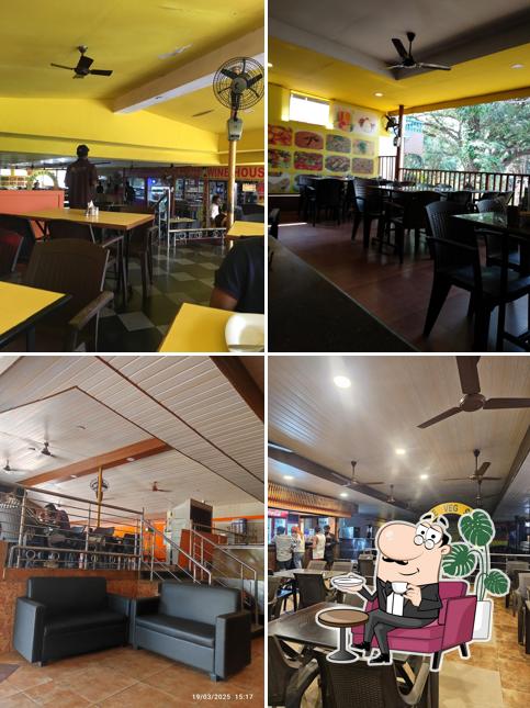 Take a seat at one of the tables at Ratnasagar Family Restaurant & Bar