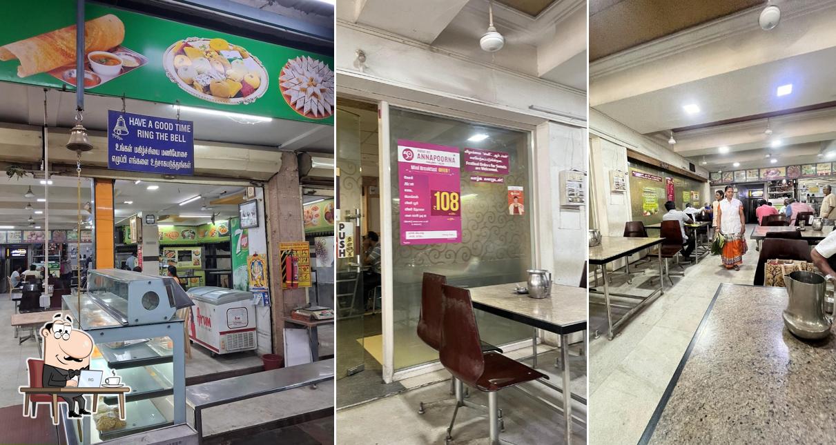 Take a seat at one of the tables at HOTEL SRI ANNAPOORNA