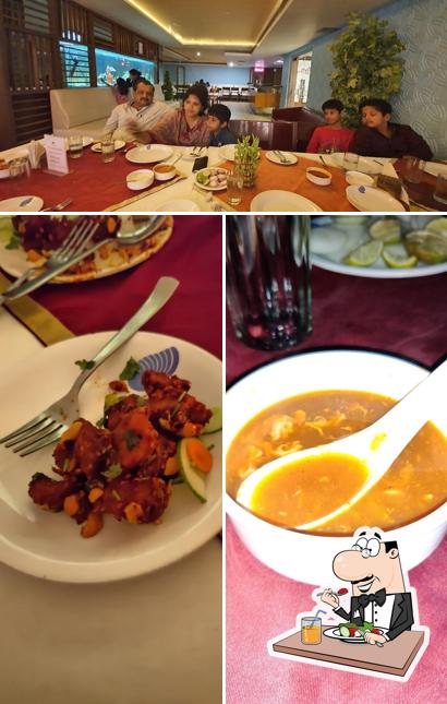 The picture of Maitri Restaurant’s food and dining table
