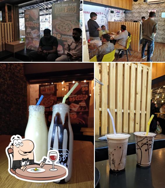 Take a look at the picture depicting food and interior at Food Mohalla
