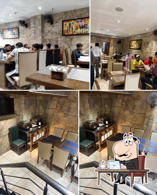 Take a seat at one of the tables at Brar Buffet and Dhaba