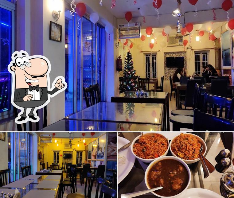 Check out the picture displaying interior and food at FOOD ON GANGES