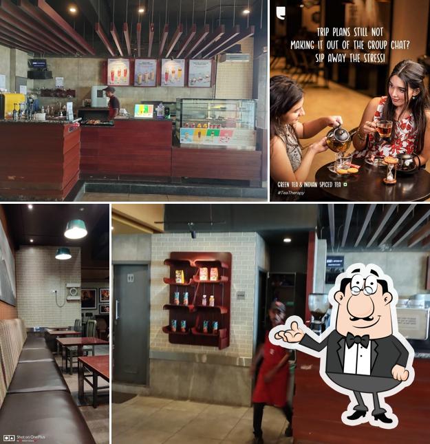 Take a seat at one of the tables at Café Coffee Day