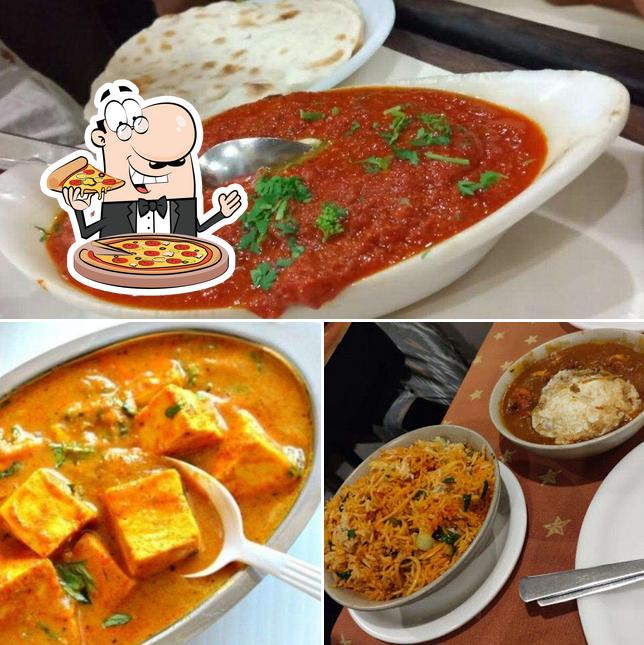 Pick pizza at Milan Punjab Restaurant