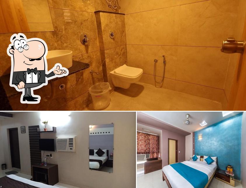 Take a seat at one of the tables at Hotel Rudra Regency