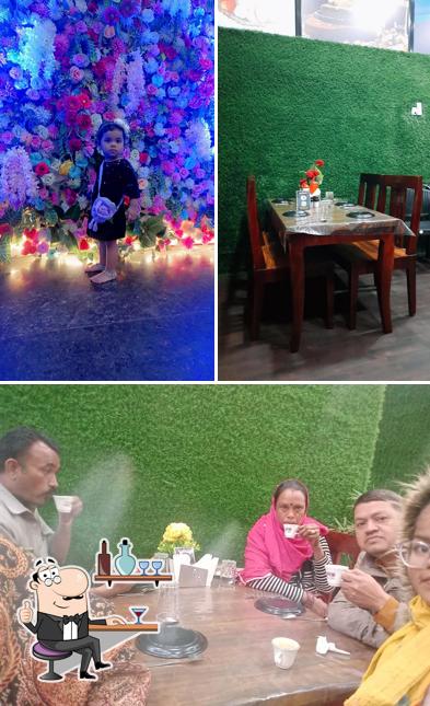Take a look at the image depicting interior and food at BAL KRISHNA RESTAURANT