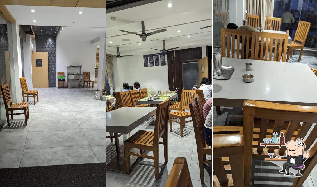 Take a seat at one of the tables at SHREE LAKSHMI BHAVAN A/C