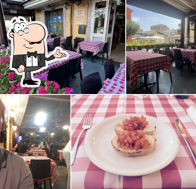 Siediti a un tavolo di La Trattoria Da Ugo