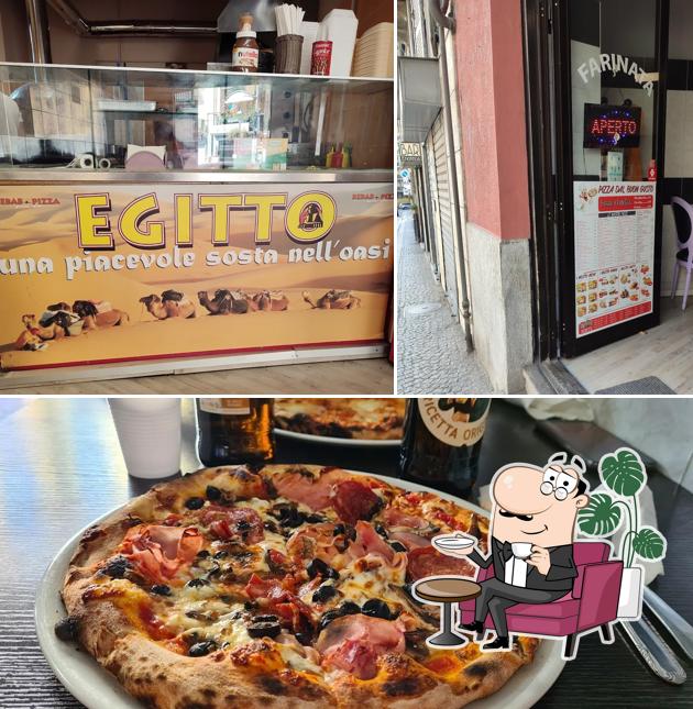 La immagine della interni e pizza di Pizzeria Adam Kebab