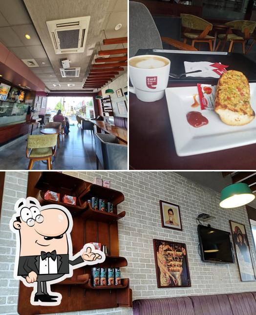 Take a seat at one of the tables at Café Coffee Day