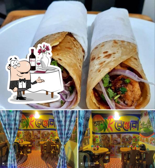 Among different things one can find dining table and food at Aam R Restora
