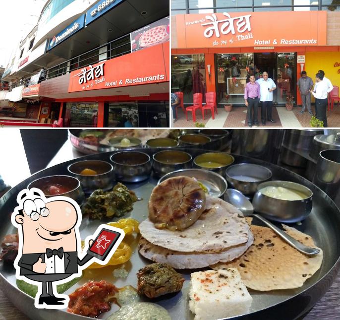 The image of exterior and food at Hotel Naivedya