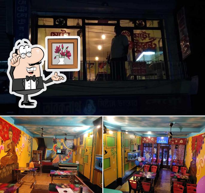 Take a seat at one of the tables at Metro Hotel And Restrurent