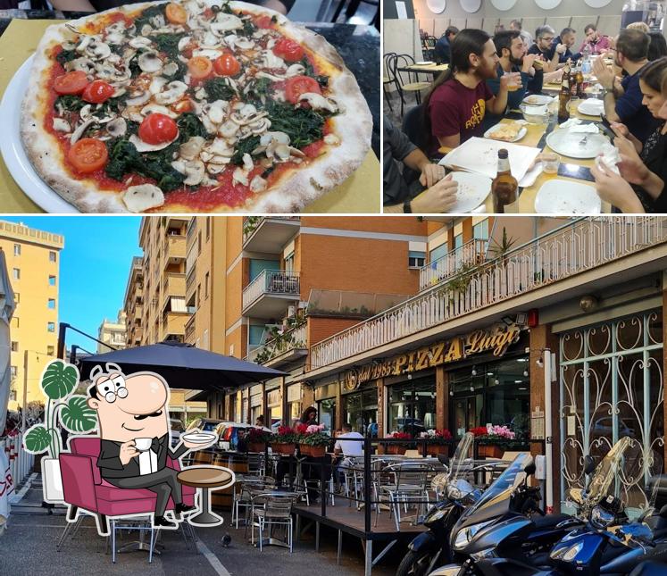 La immagine di interni e pizza da Pizza Luigi dal 1985