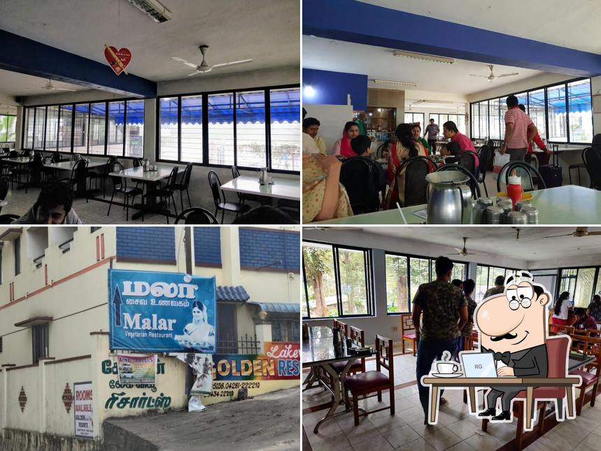 The interior of Malar Pure Veg Restaurant