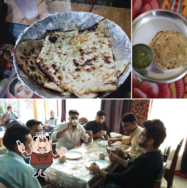 Among various things one can find food and dining table at MAA SHEETLA SUDH FAMILY DHABA