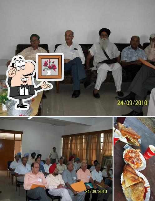 This is the image depicting interior and sandwich at Sukhdev Singh LPM dhaba ( Dairy Farm Canteen)