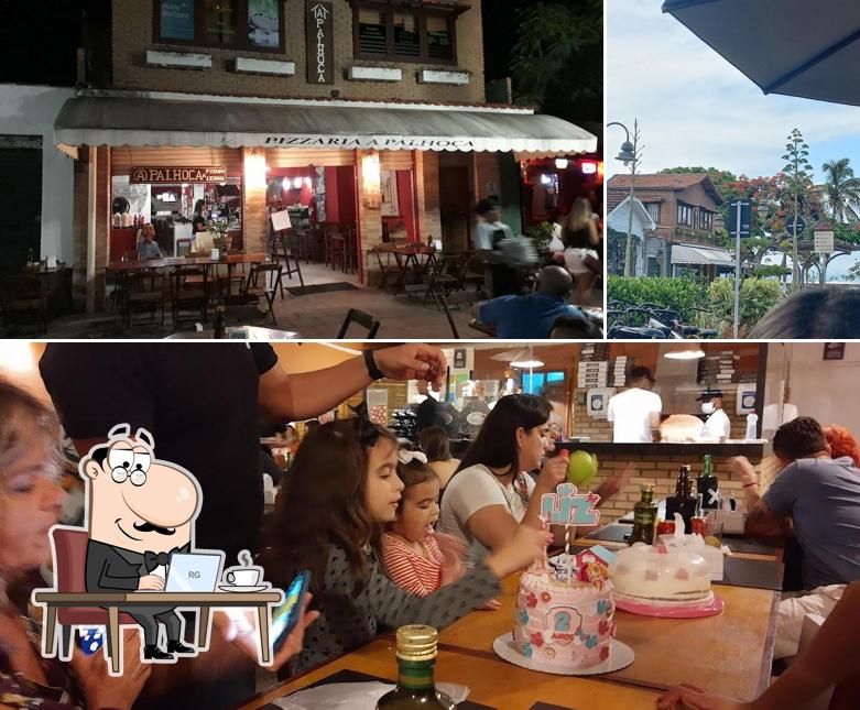 Esta é a imagem apresentando interior e exterior a Pizzaria A Palhoça