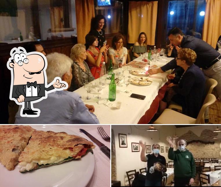 La immagine di interni e cibo da Pizzeria Pizzoleria Le Monache