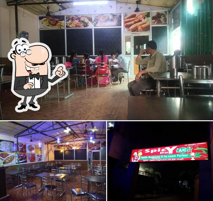 Take a seat at one of the tables at SPICY DAY FAMILY RESTAURANT