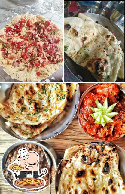 Get pizza at Swad Royal Restaurant
