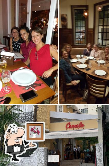 Sente em uma das mesas no Pizzaria Camelo - Ipanema