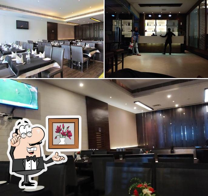 Take a seat at one of the tables at Enjoy Restaurant