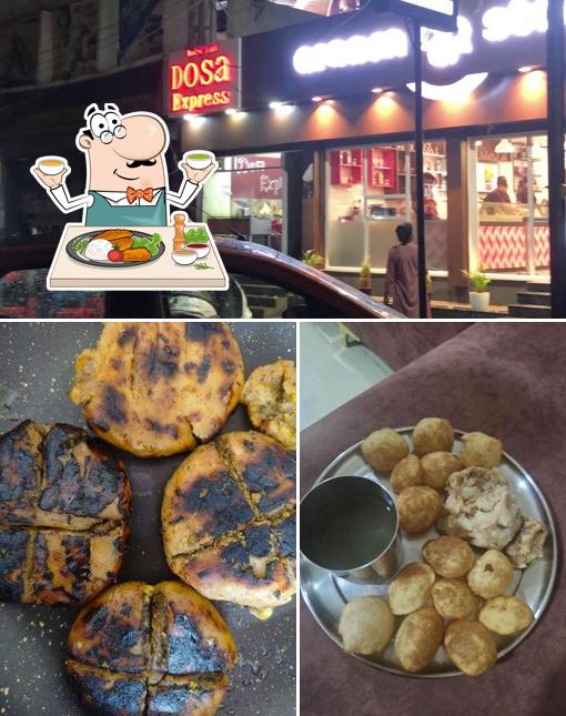 Take a look at the picture depicting food and interior at Litti chokha