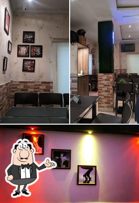 Take a seat at one of the tables at Shree Nawab Restaurant, Club Road