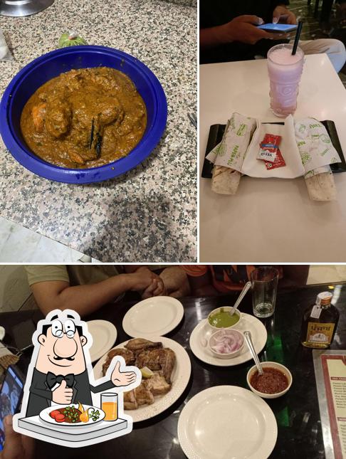 Among various things one can find food and dining table at Tandoori Point