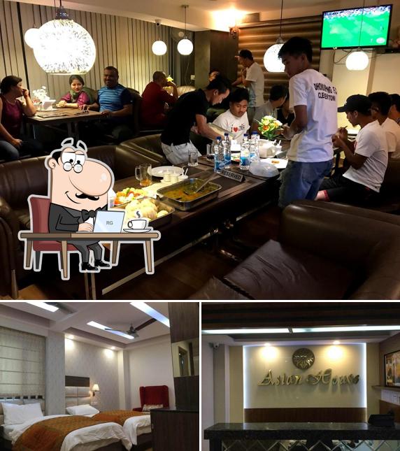 Take a seat at one of the tables at Asian Home Restaurant
