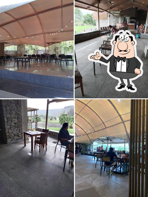 Take a seat at one of the tables at Kharghar Golf Course Pavithra Cafe