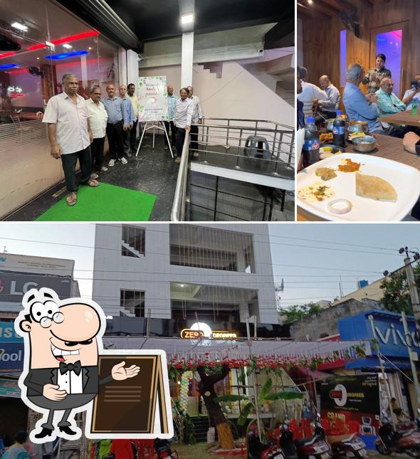 Among different things one can find exterior and dining table at Vennela's Sai Zero Degrees Robot Restaurant