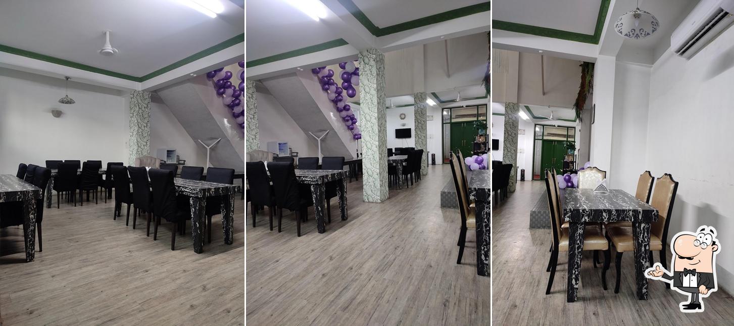 Take a seat at one of the tables at Aroma Eatery
