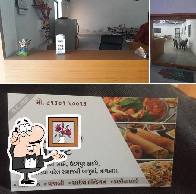 Check out the image depicting interior and food at Neelkanth restaurant