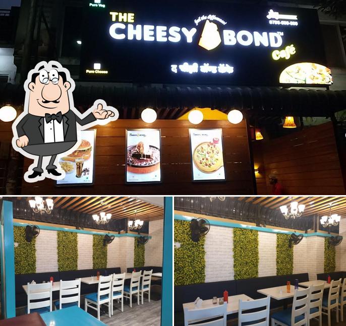 Take a seat at one of the tables at The Cheesy Bond Cafe