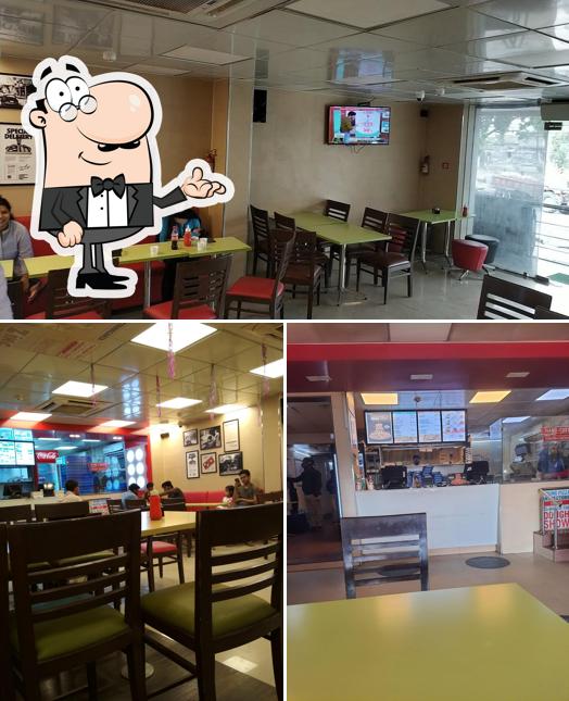 Take a seat at one of the tables at Domino's Pizza Indrapuri Chowk, Hazaribagh
