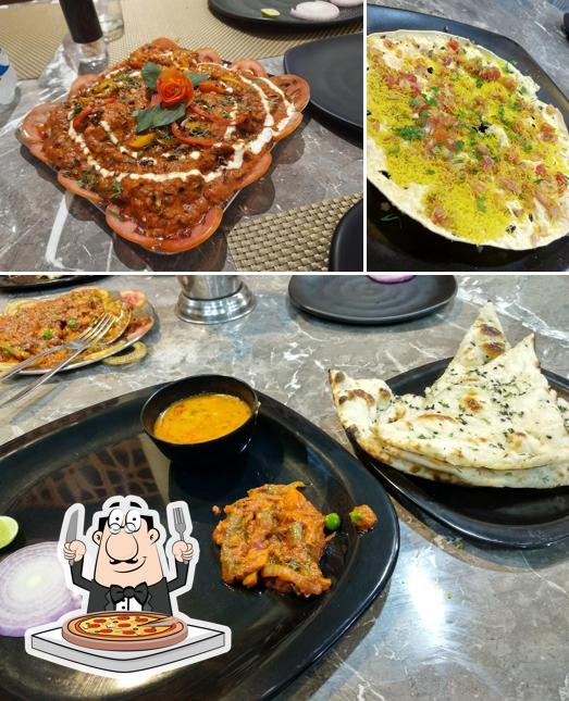 Try out pizza at Hotel Shankara [DUSK Meadows Restaurant]