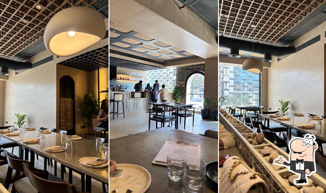 Take a seat at one of the tables at Pizza and Frends