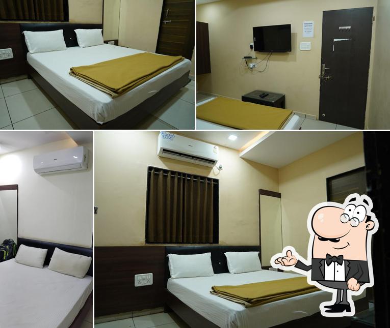 Take a seat at one of the tables at Madhuram hotel & room,s