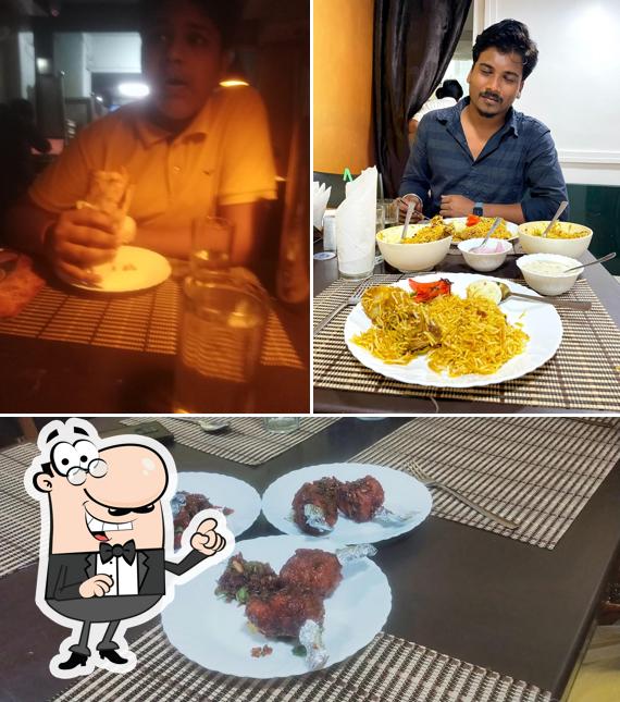 Check out the image displaying interior and food at The Saffron Food Plaza