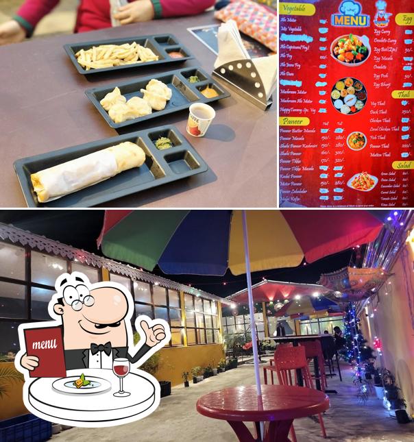 Take a look at the photo displaying food and interior at Happy Tummy