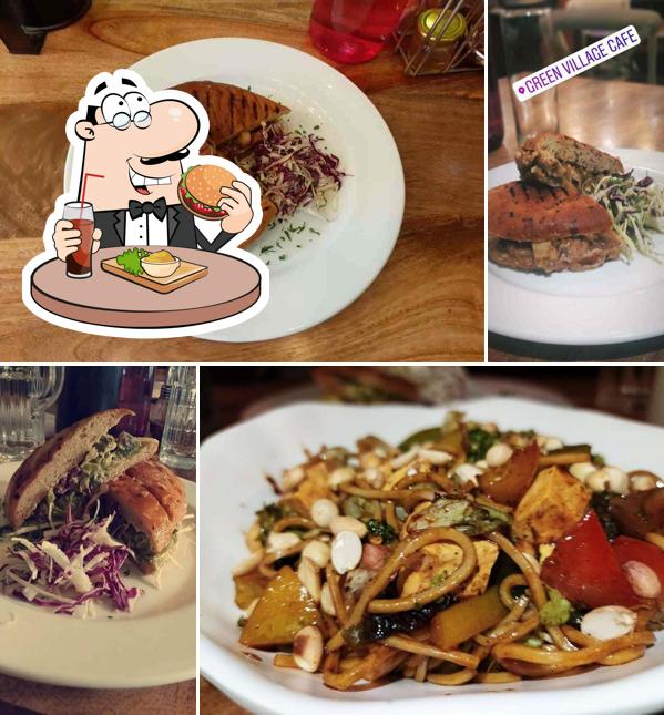 Order a burger at Green Village Cafe