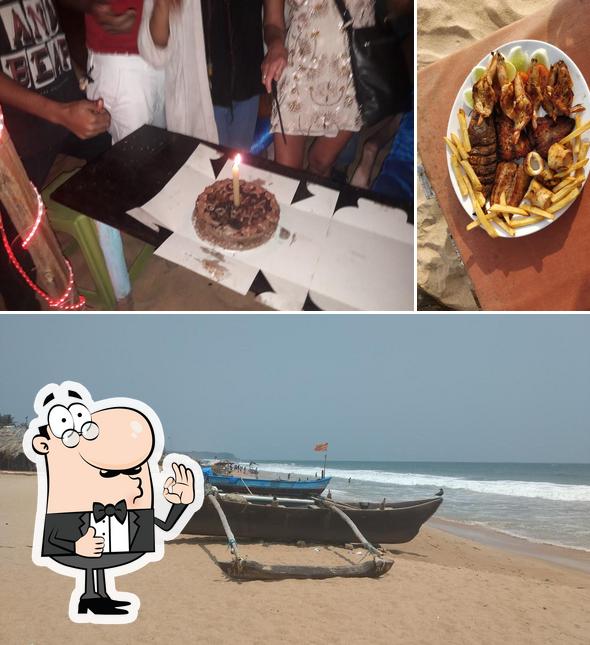 Look at the photo of Temptation Beach Shack