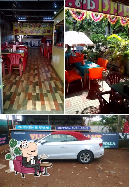 Take a seat at one of the tables at PRANAV RESTAURANT